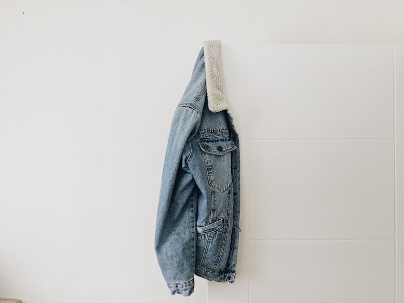 A denim jacket on a hanger