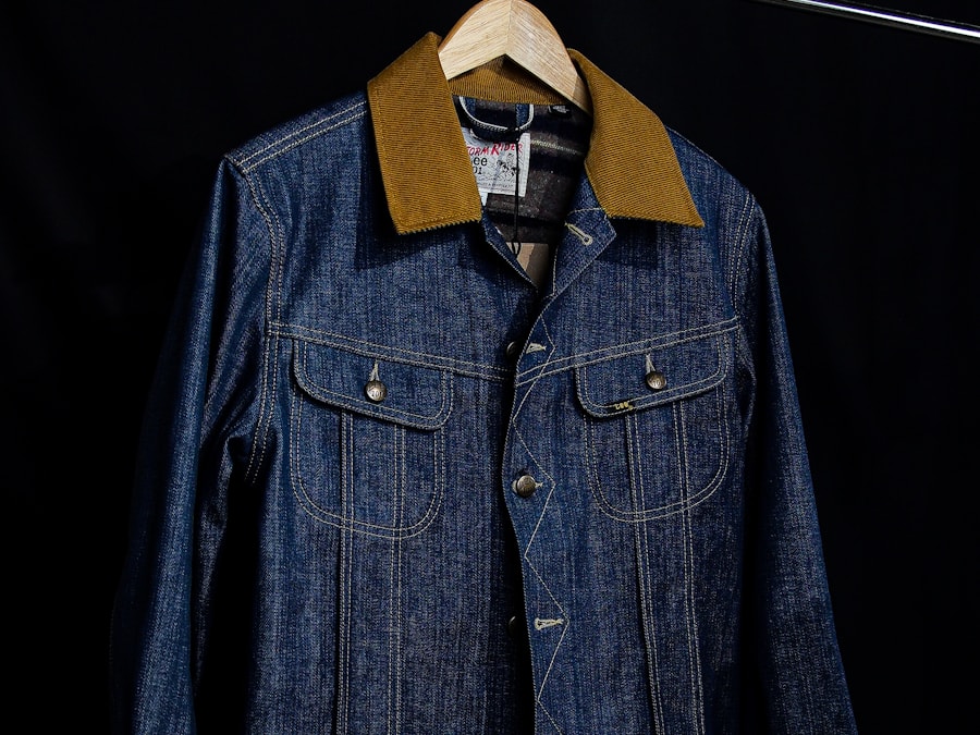A vintage denim trucker jacket with a corduroy collar