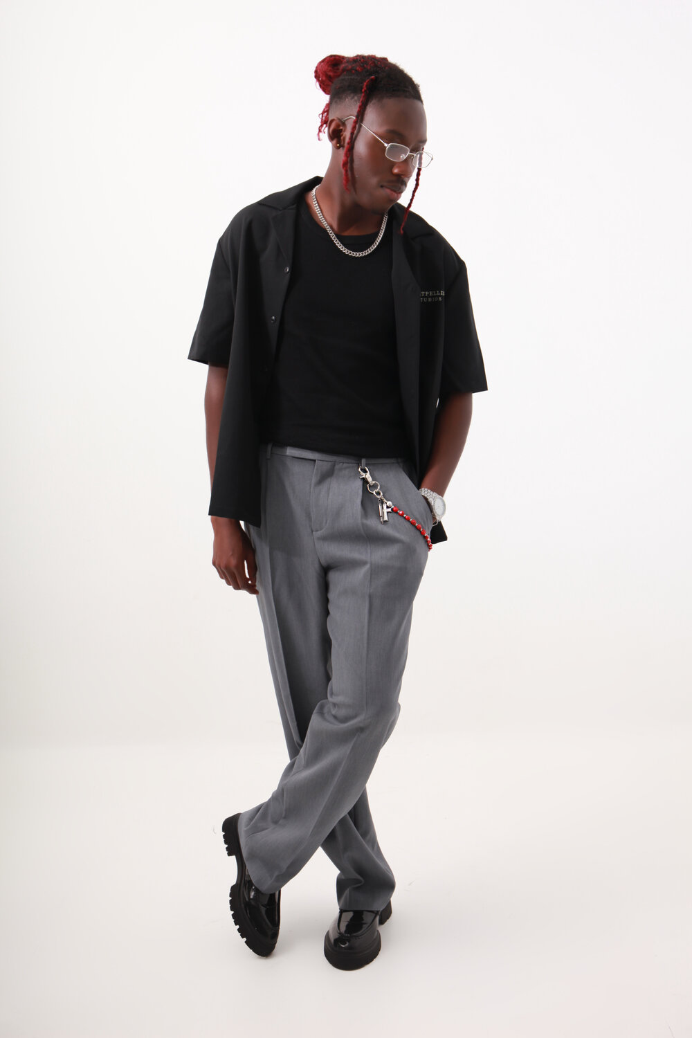 Minimalist outfit: black overshirt and grey trousers